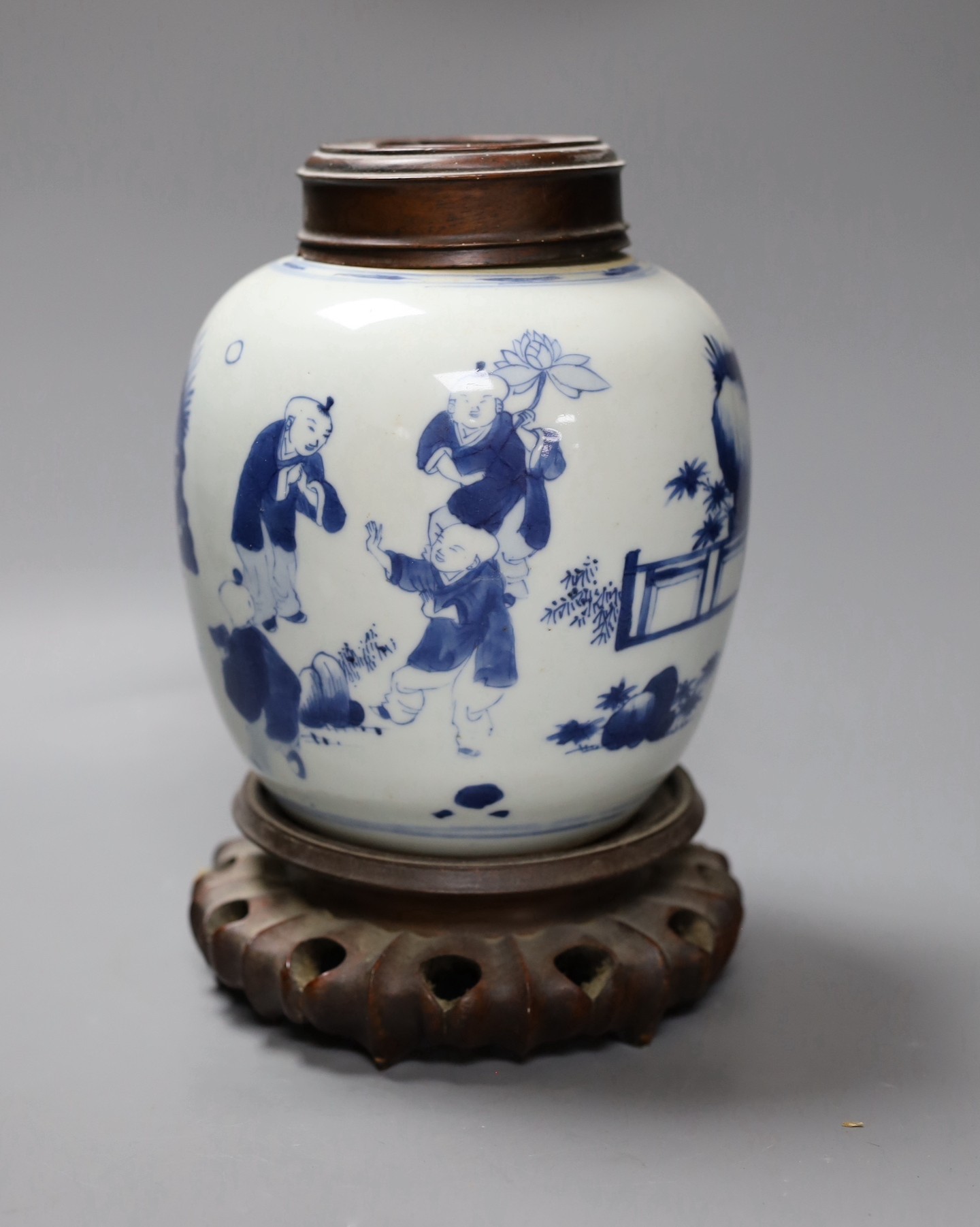 A Chinese blue and white 'boys' jar, 19th century, wood cover and stand, total height 24cm high